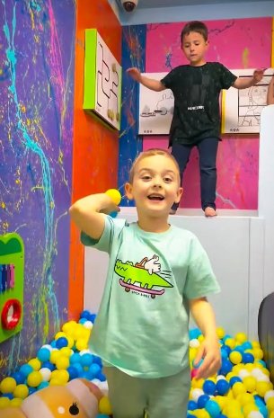 Kids playing in the ball pit at TOTville.